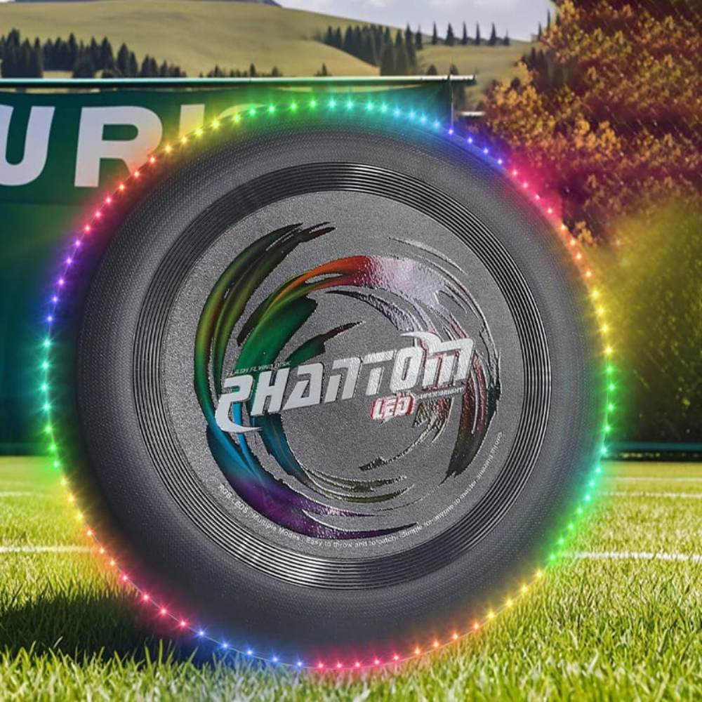 Wikz Aero Glow LED frisbee i sort, vist på skov baggrund