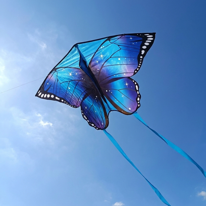 Wikz Sommerfugl Pro drage i blå flyver på himlen